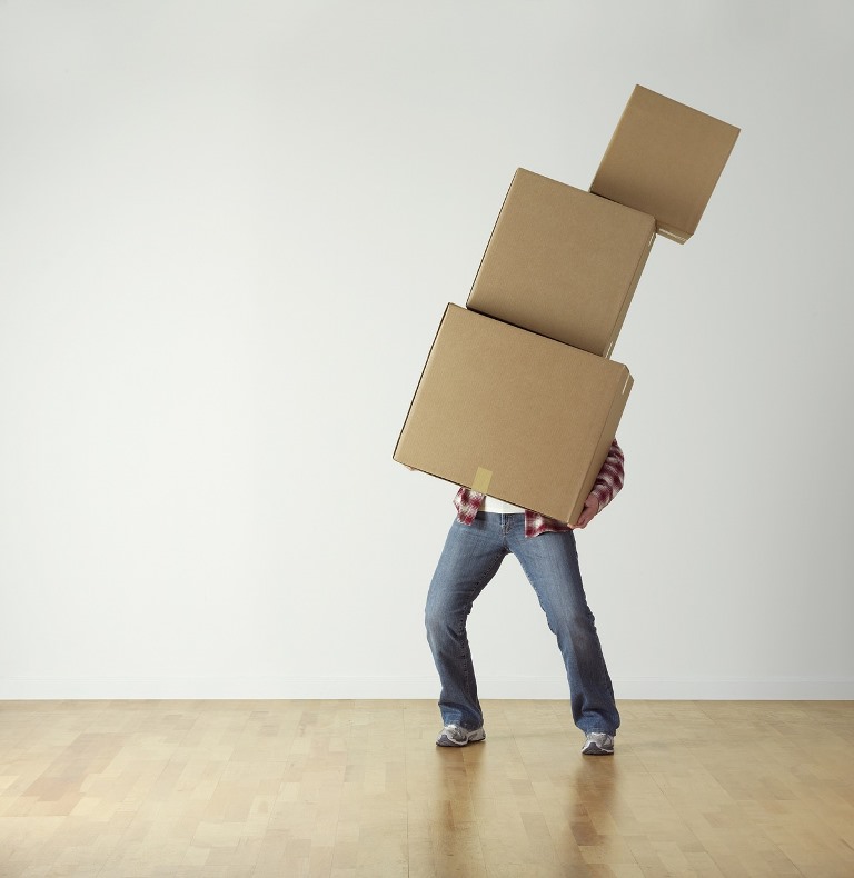 man moving boxes